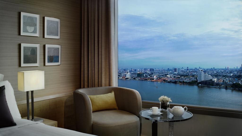 Avani Plus Riverside Bangkok Hotel Exterior photo A view of the Chao Phraya River from a suite at the hotel
