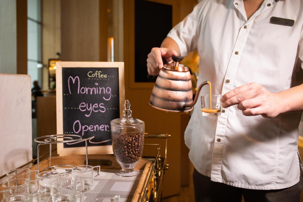 Avani Plus Riverside Bangkok Hotel Exterior photo Coffee being served at a coffee shop